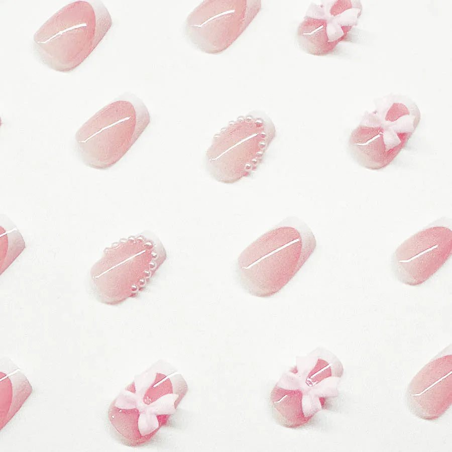 Short white French press-on nails with bow and tulip designs in European square shape