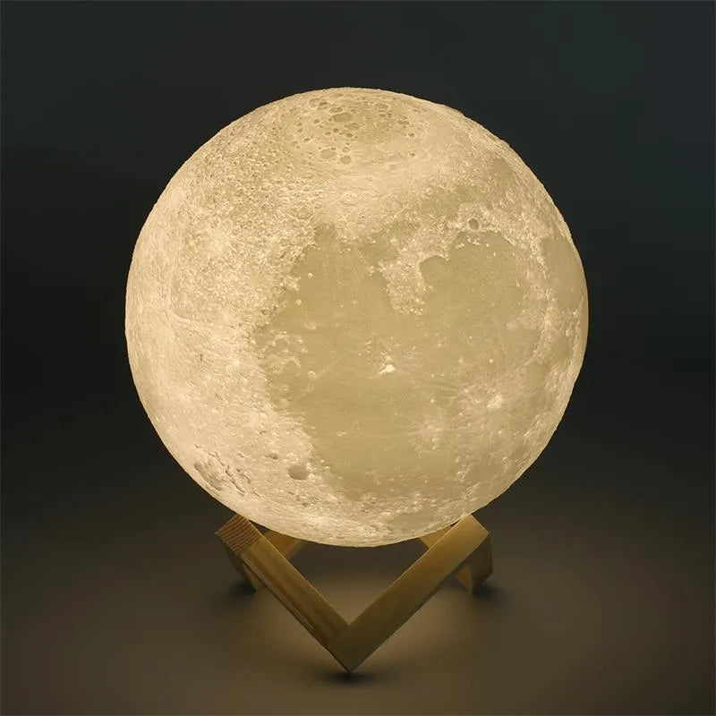 3D printed moon light lamp on wooden stand with detailed lunar surface, showing touch ring at base.