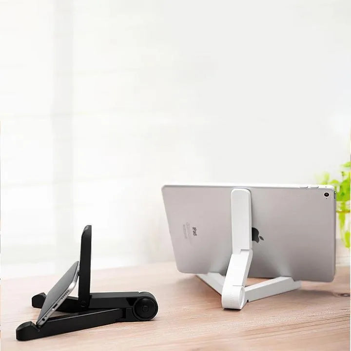 Black foldable tablet holder displaying smartphone at adjustable angle on desk