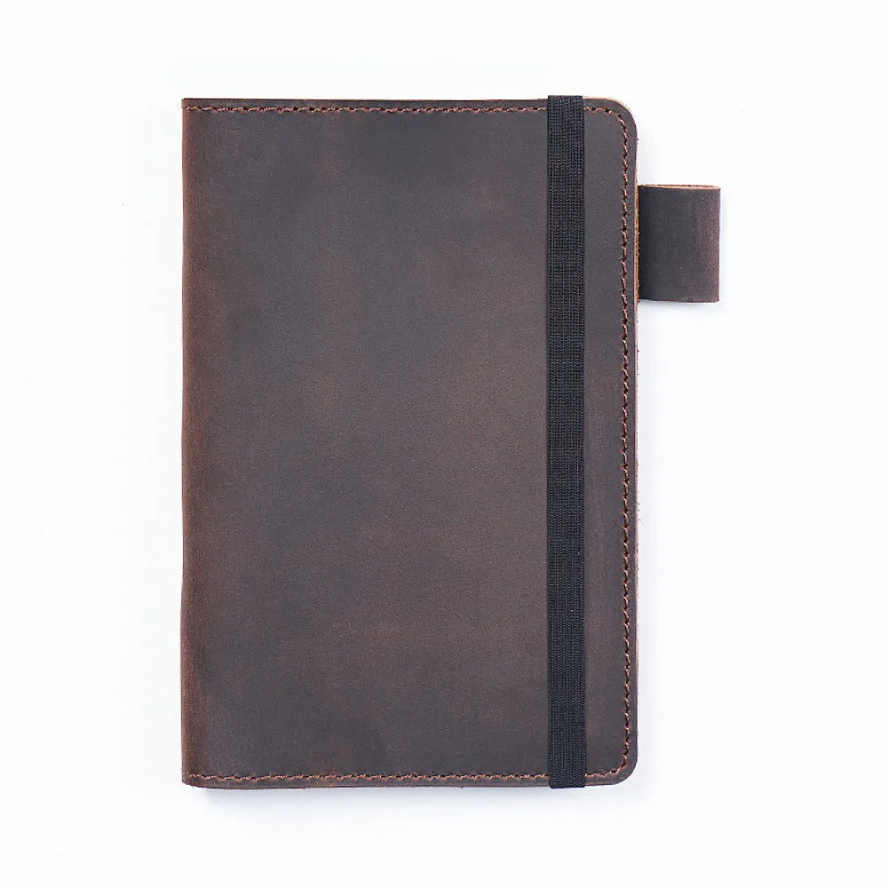 Handmade cowhide kraft notebook open showing wood-free paper with dark green cover option
