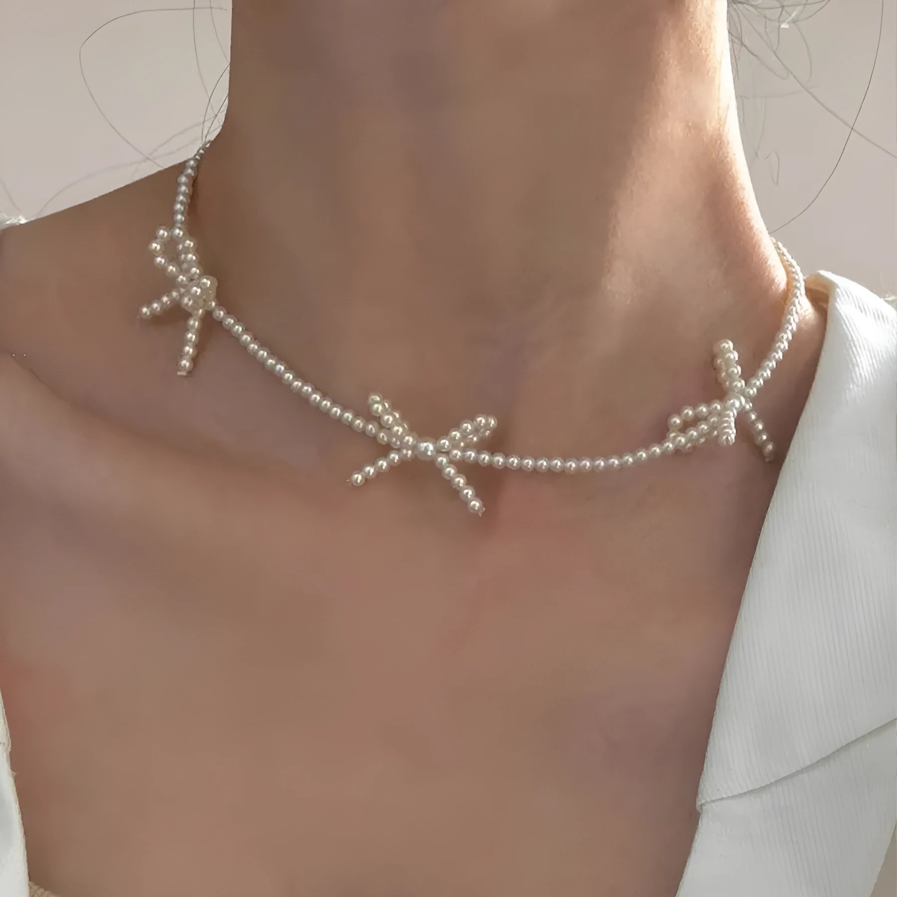White sweet bow pearl necklace with geometric design on adjustable 31-40cm clavicle chain