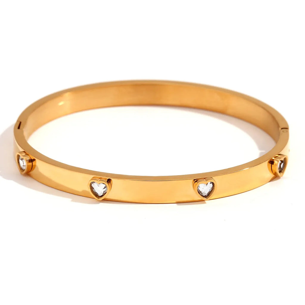 Stainless steel women's bracelet with micro-inlaid peach heart design in electroplated golden finish