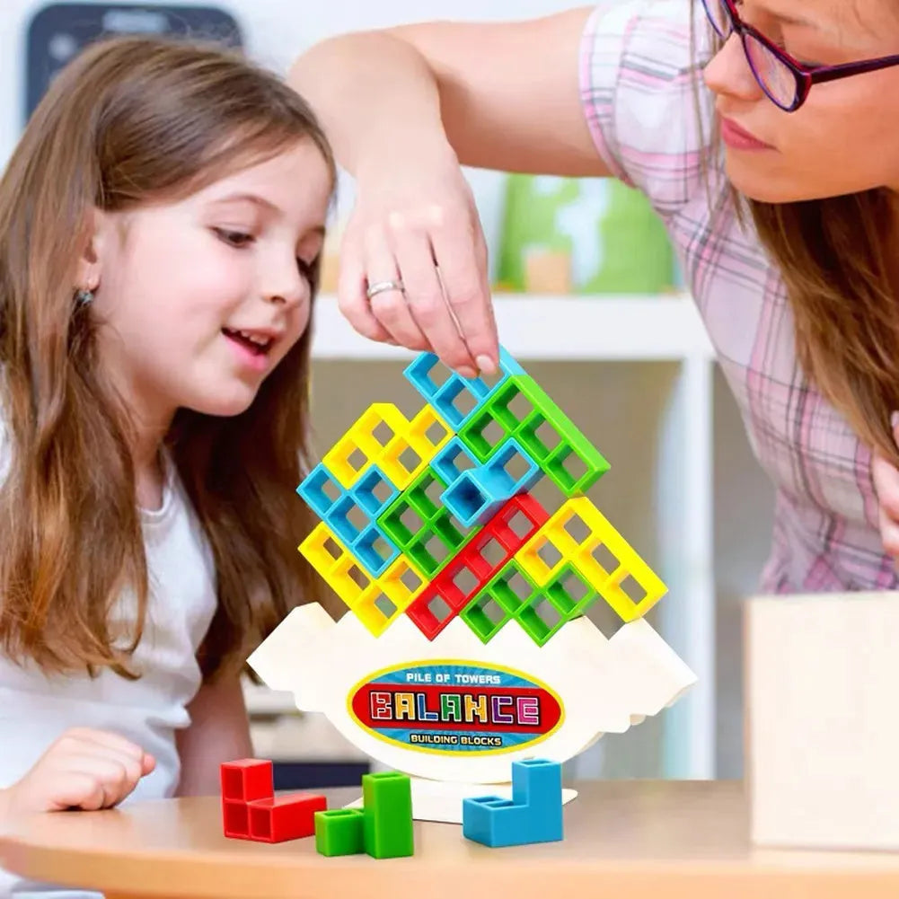 Plastic balance stacking board game with colourful blocks, chassis, and base on table