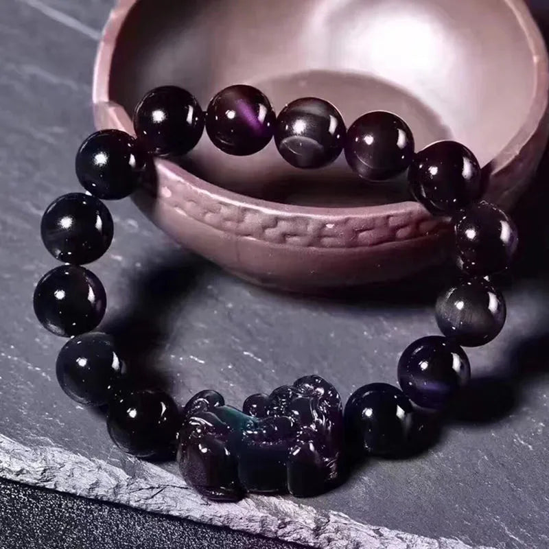 Natural ice colour Eye Obsidian crystal bracelet with elastic band, showing different bead size options.