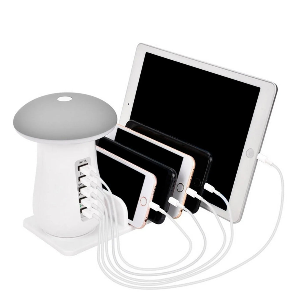 White USB charging station with five ports and built-in LED night light on wooden desk