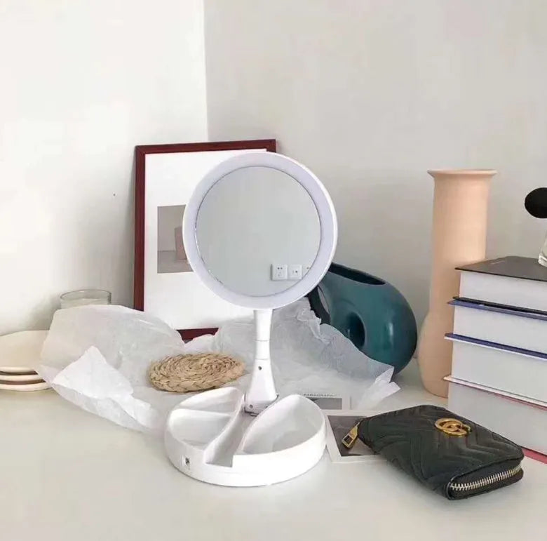 White acrylic LED vanity mirror with USB port and foldable storage compartments