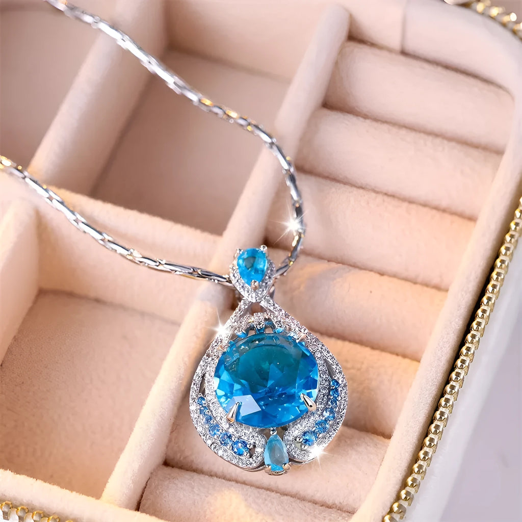 Blue fireworks cut gem geometric pendant necklace with water wave chain on woman