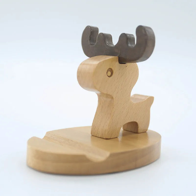 Solid beech wood mobile phone stand with a decorative resin animal ornament and a coin slot.