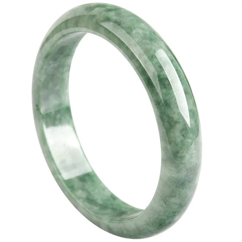 A simple deep pea green ring bracelet for women on a white background, showing its adjustable size.