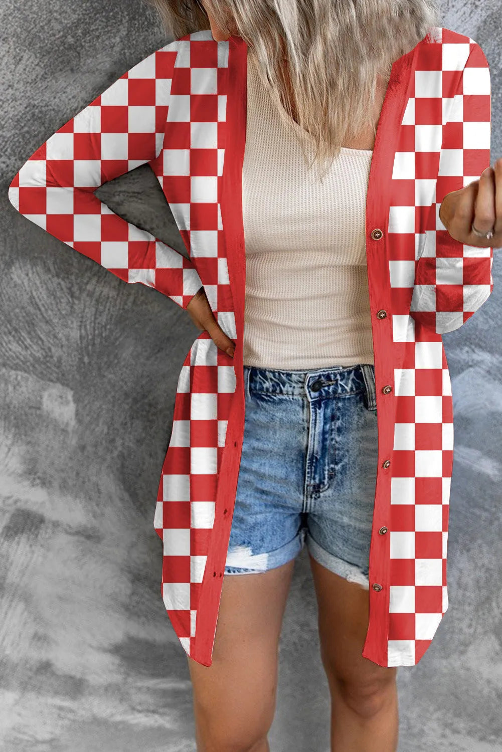 Long grey plaid patterned women's knitted cardigan coat with loose fit and regular sleeves.