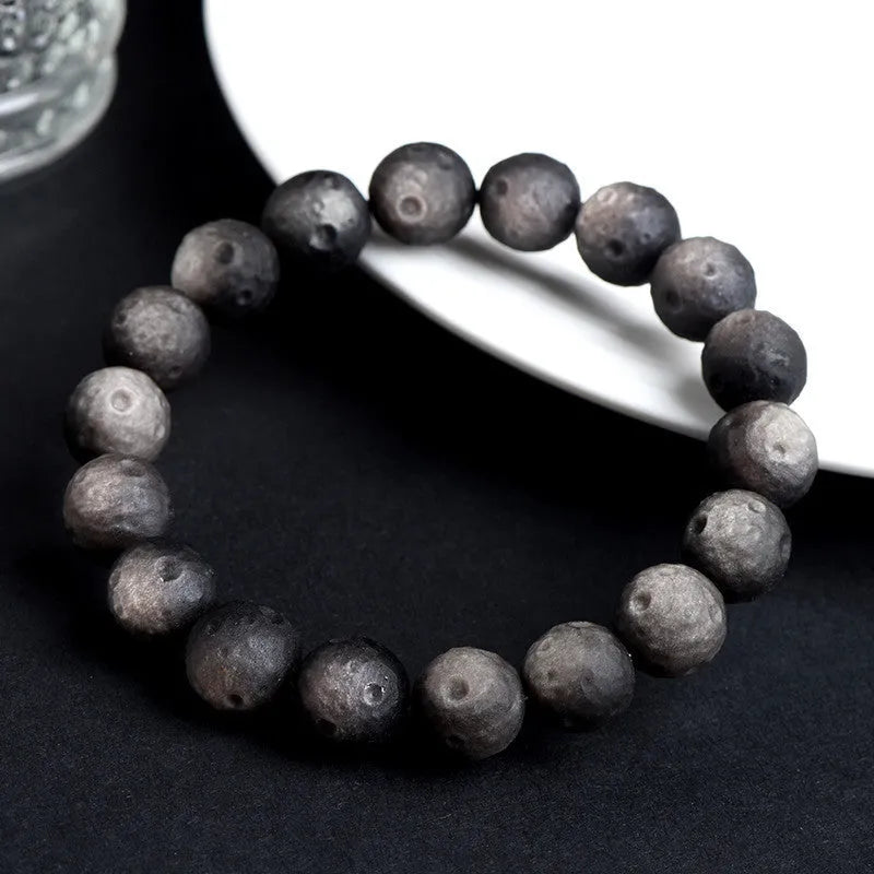 Natural obsidian crater ball bracelet with ground texture beads in silver or golden meteorite colours