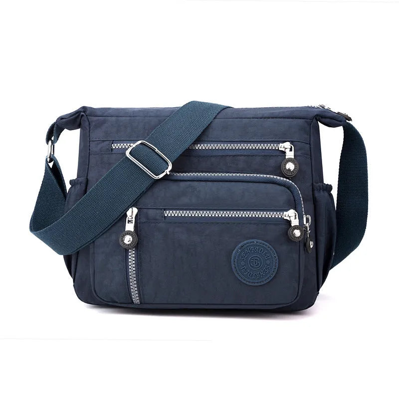 Soft nylon messenger bag with shoulder strap in square vertical shape
