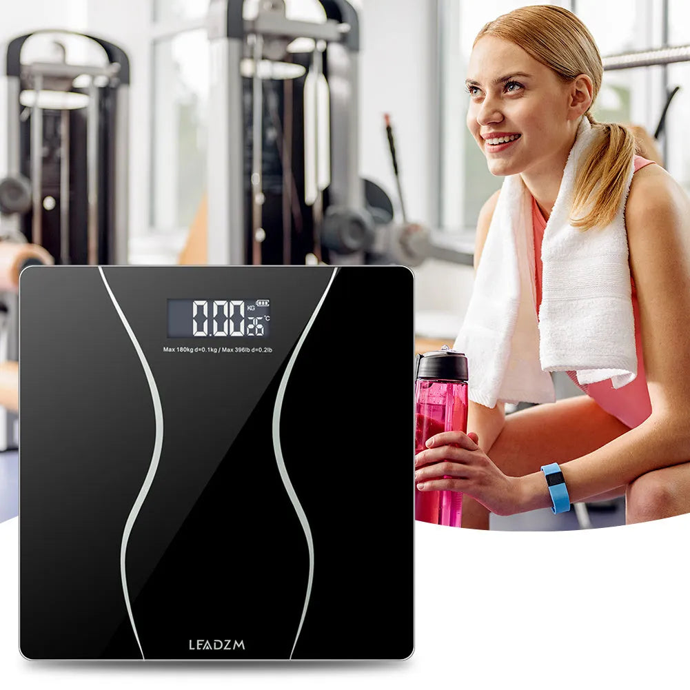 Black electronic bathroom scale with digital display, 180 kg capacity