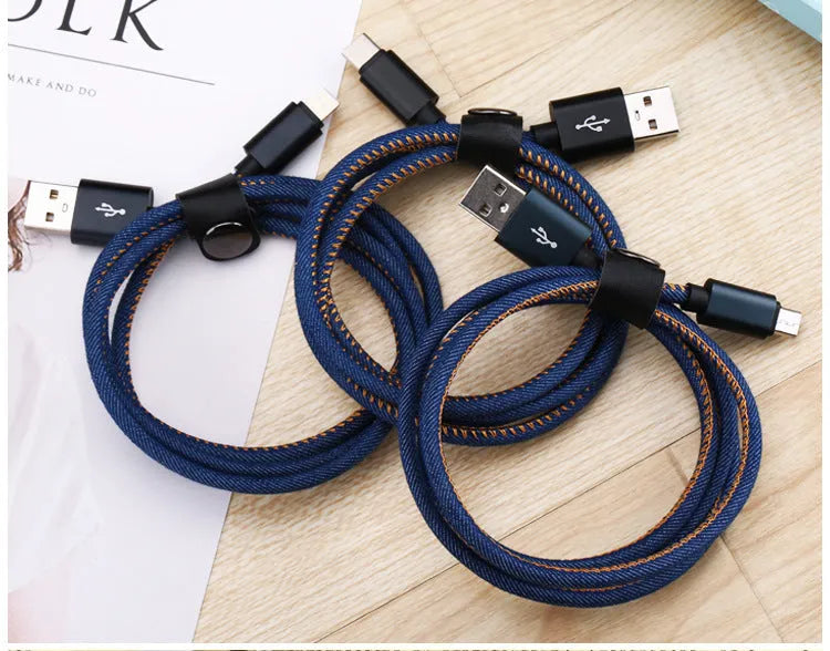 Close-up of a denim-braided USB-C cable with aluminium connectors in choice of colours.