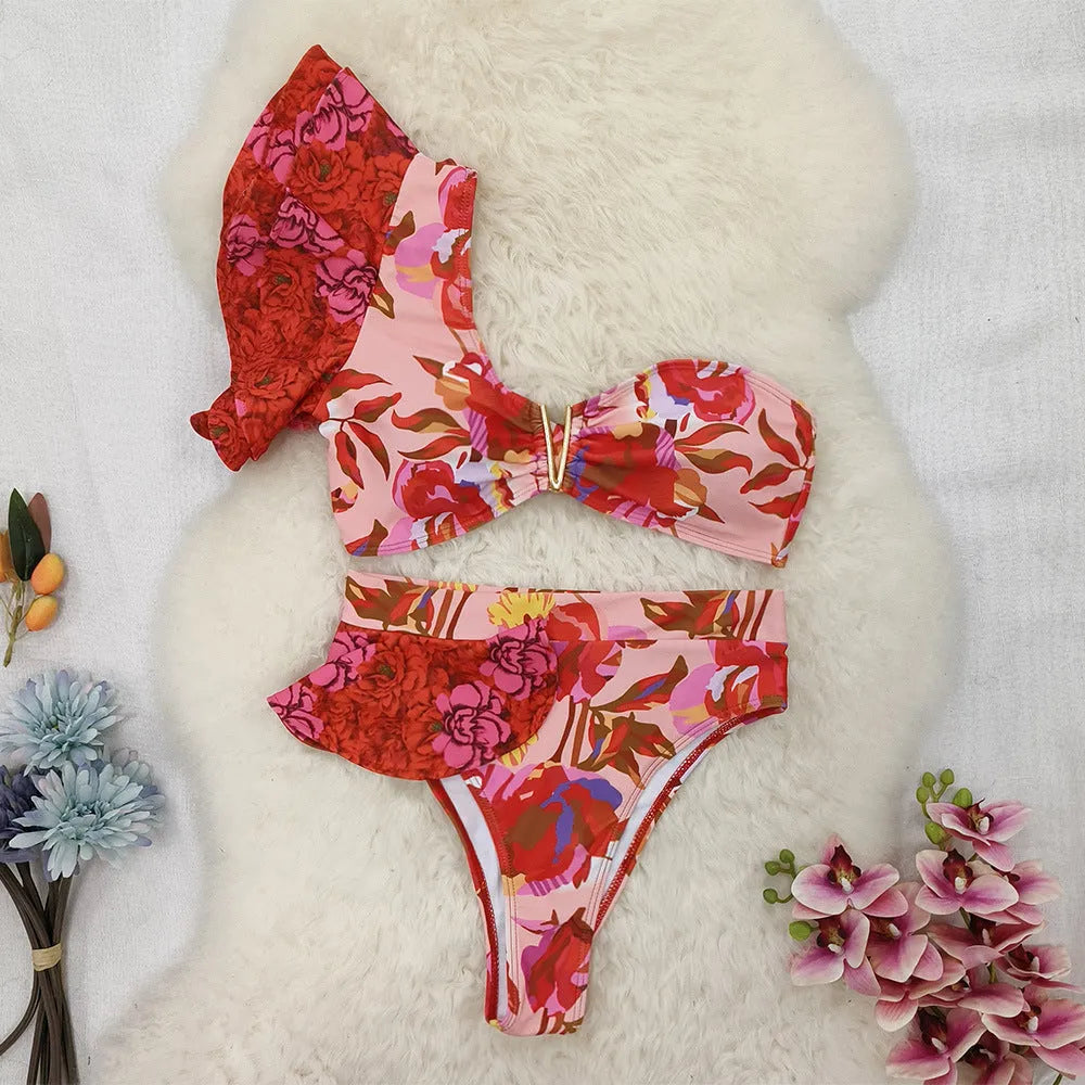 Pink floral print women's one-shoulder ruffled swimsuit with high-waist bikini briefs.