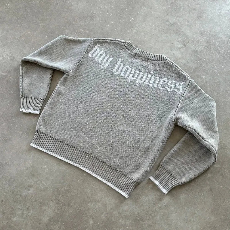 Grey loose-fitting jacquard knitwear coat with long sleeves on a hanger