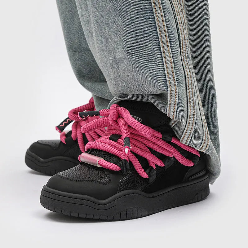 Low-top lace-up casual sneakers in denim blue with a round toe and thick rubber sole.