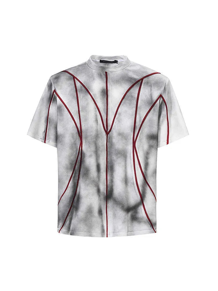 Women's grey padded shoulder t-shirt with textured patchwork design on the front.