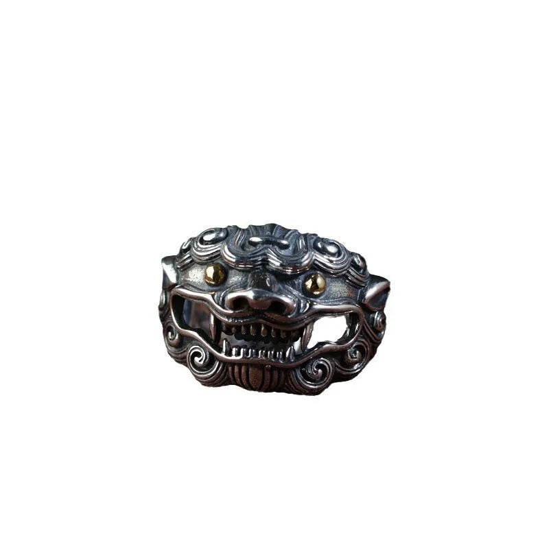 Silver open ring with a detailed domineering Jibeast animal pattern on a model's finger.