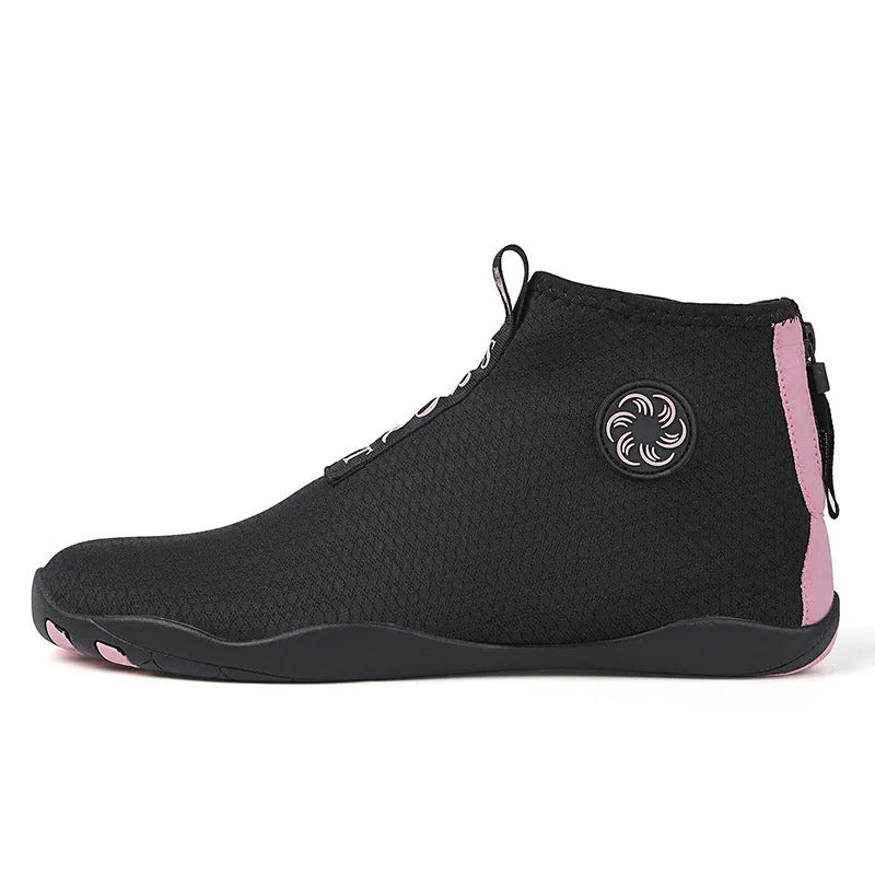 Casual mid-top outdoor beach shoes in black with coloured accents, showing mesh upper and rubber sole.