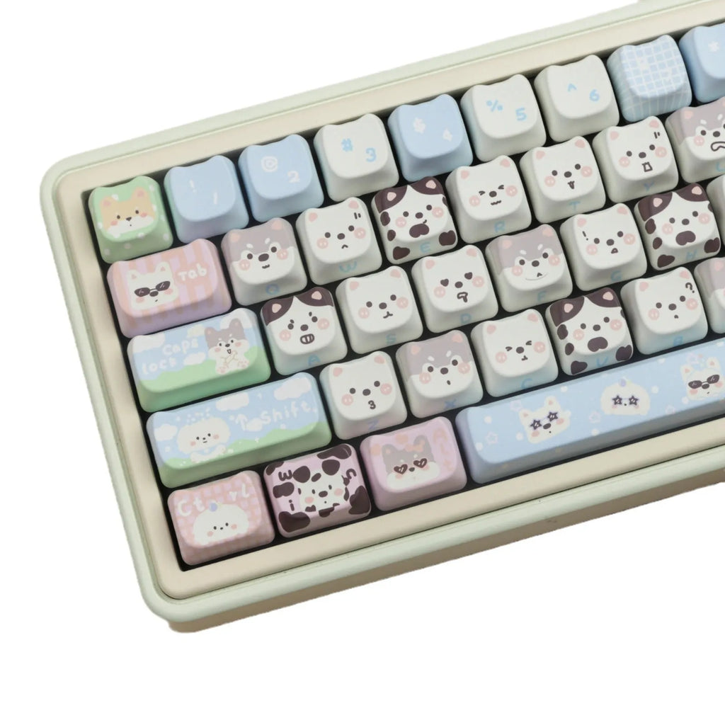 PBT sublimation keycap set showing detailed puppy and cat designs on mechanical keyboard keys