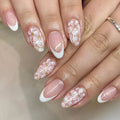 Removable short almond artificial nails with French style glitter flower design in colour C625