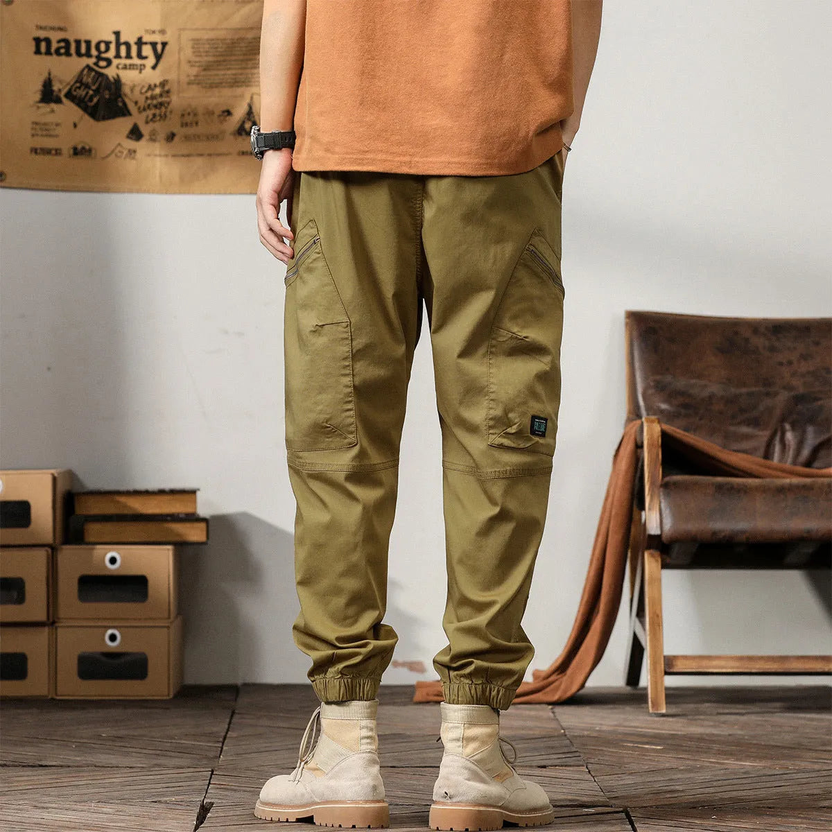 Men's khaki cotton harem pants with tapered ankle band and zip placket front view
