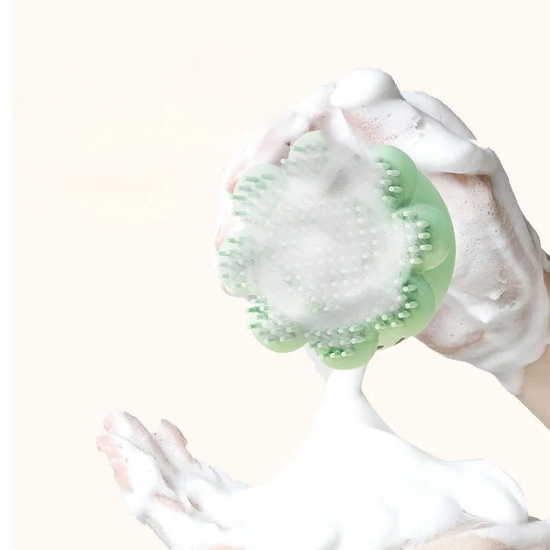 Silicone pet bath brush with body wash dispenser for dogs and cats, shown in green and purple