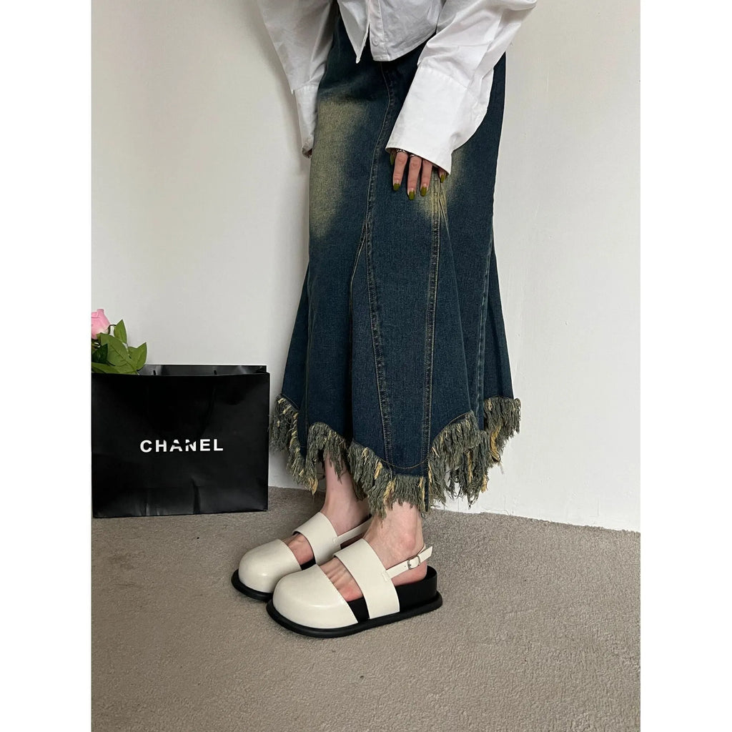 Retro apricot women's sandals with a raised sole, closed toe, and an adjustable ankle strap buckle.