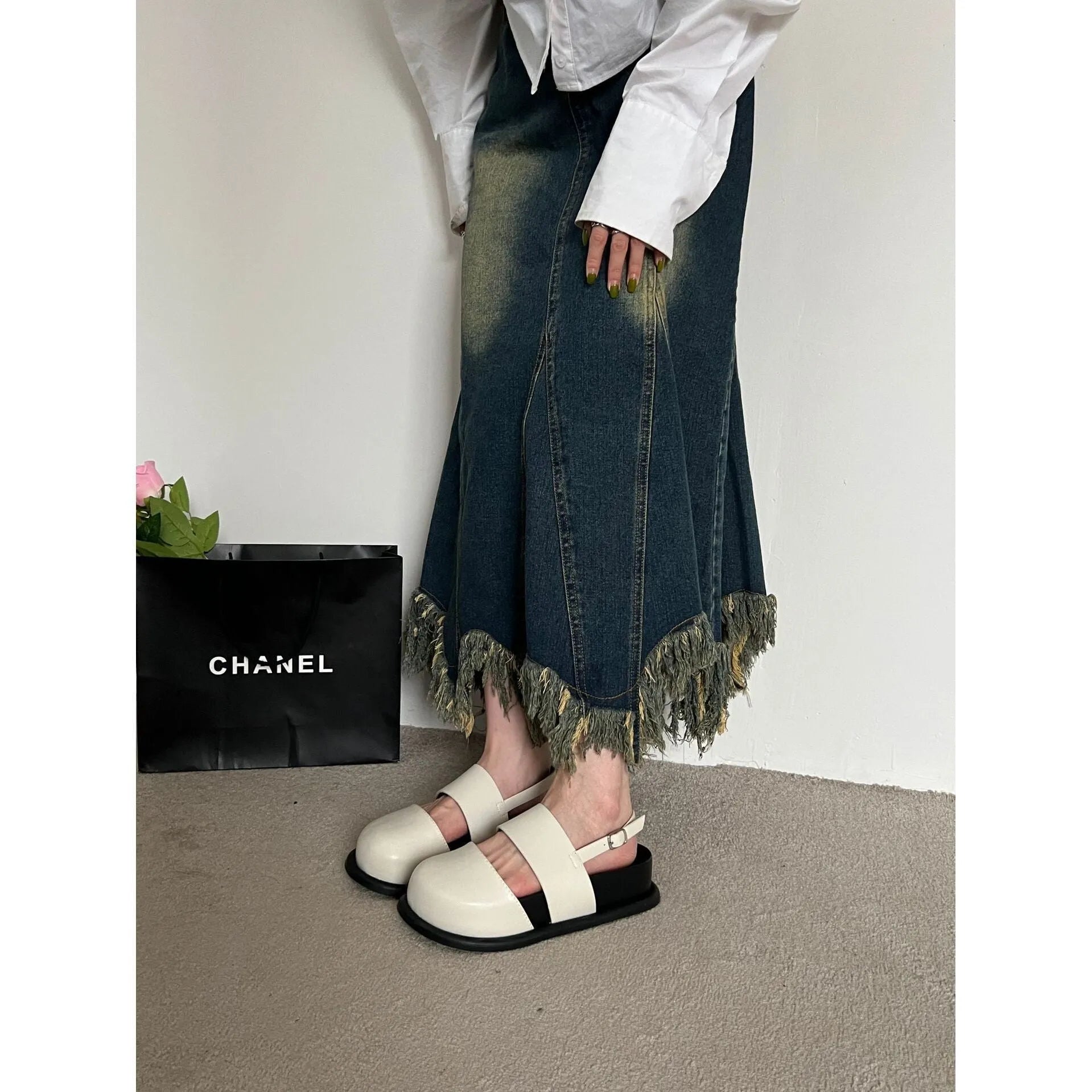 Retro apricot women's sandals with a raised sole, closed toe, and an adjustable ankle strap buckle.