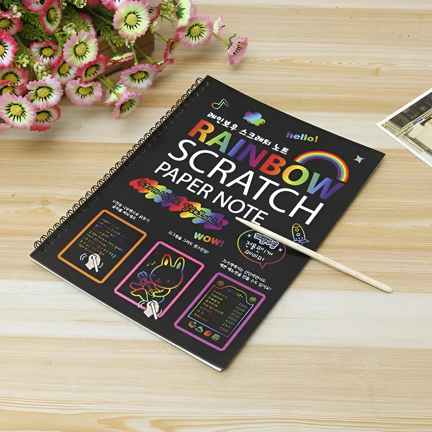 Children's large scratch art paper with scraper tool for colourful DIY painting activity.