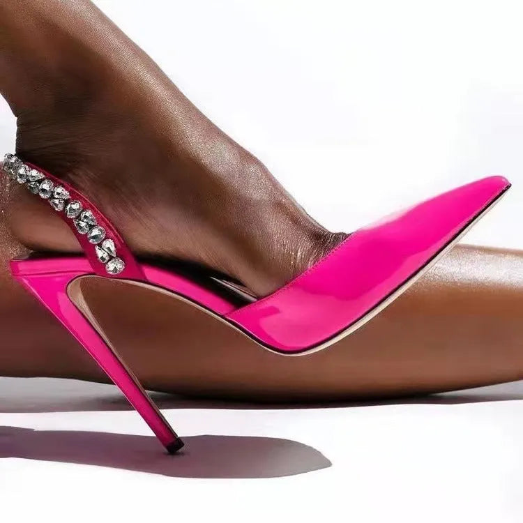 Women's black patent leather pointed toe high heel sandals with rhinestone detail on the side.