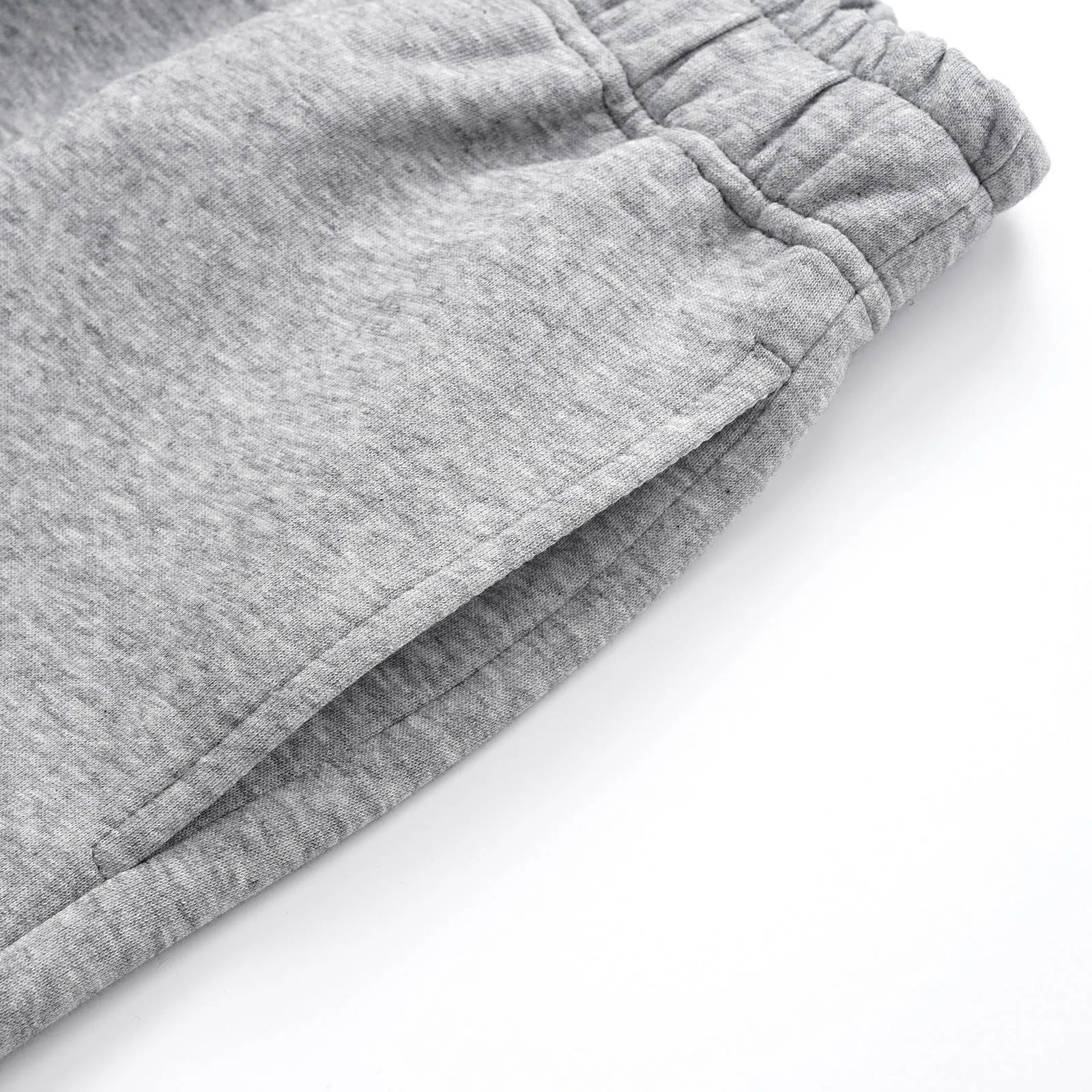 Men's straight-leg casual cotton trousers in solid black colour showing loose fit design
