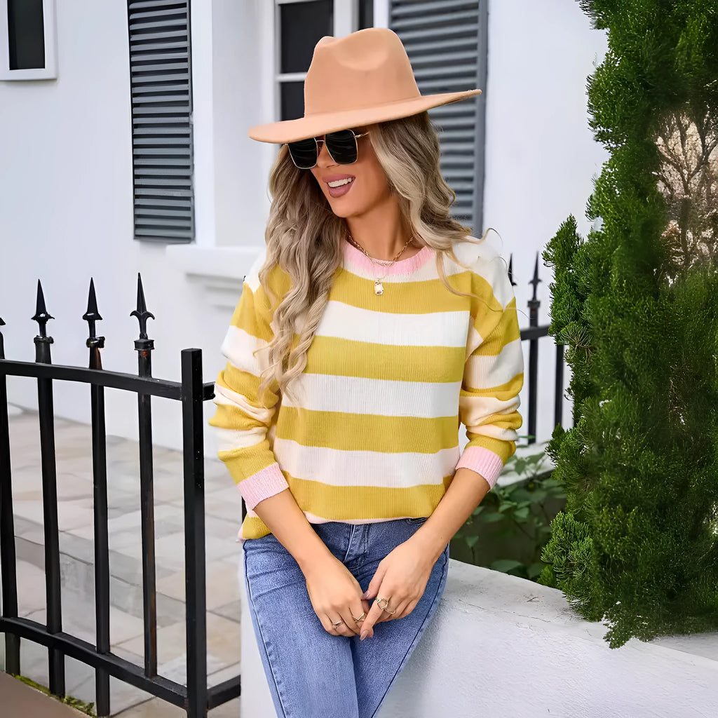 Women's loose long sleeve sweater in a striped pattern, shown in a blue colour option.