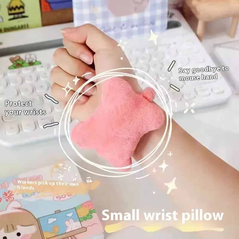 Plush mouse pad wrist protector pillow in blue colour on desk with keyboard
