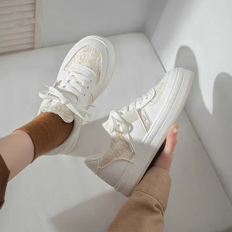 Beige platform sports board shoes with plaid pattern, rubber soles and lace-up front closure