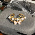 Adjustable copper ring featuring a gourd, flower, and bow design with zircon inlay in New Chinese style.