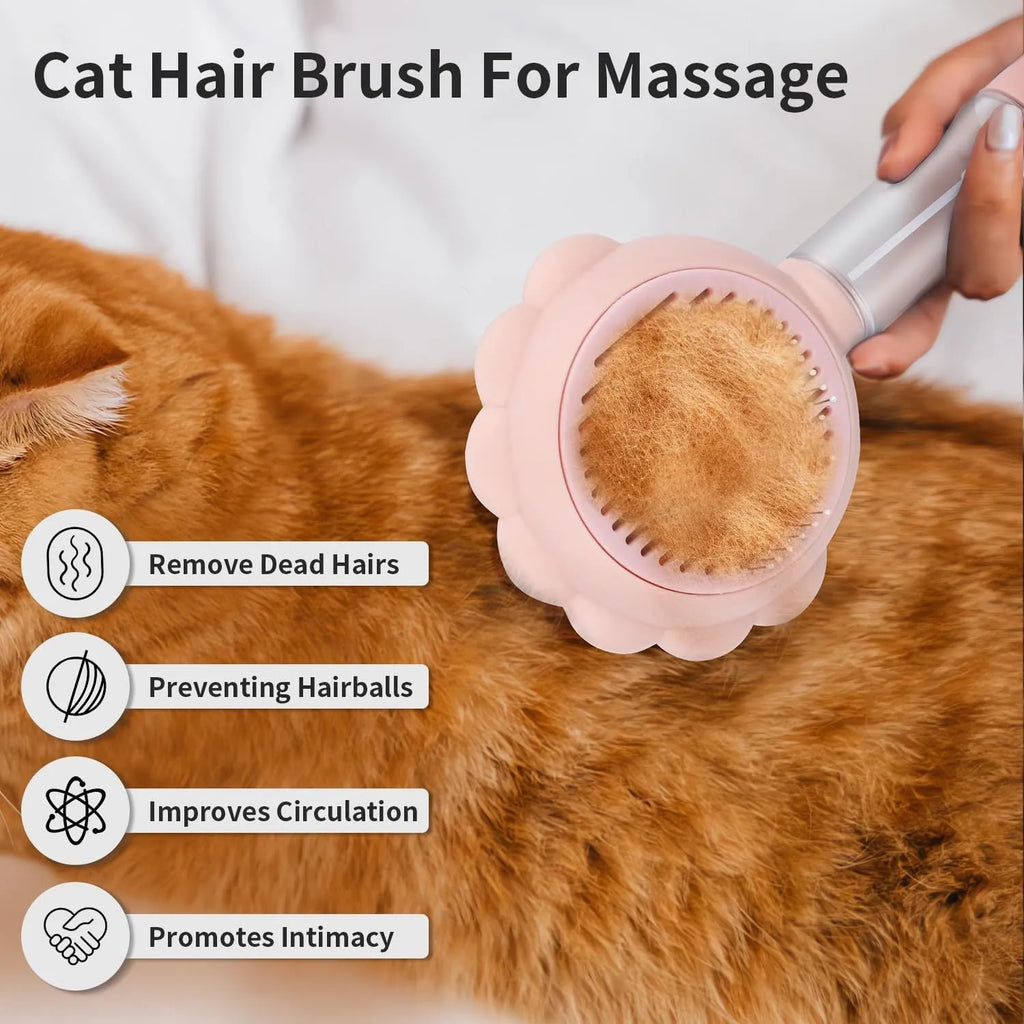 Grey, green, and pink spray cat brush with a release button and curved stainless steel bristles.