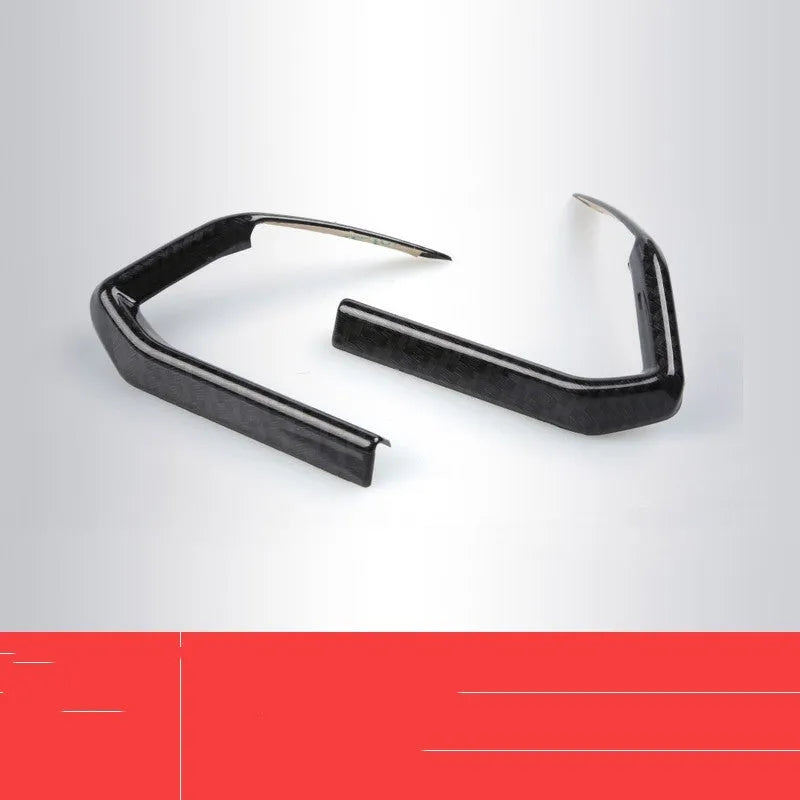 Pair of carbon fibre style ABS plastic steering wheel frame decorative covers for car dashboard installation.
