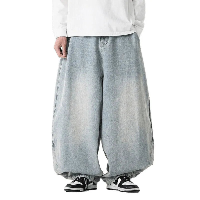 Men's plus size baggy jeans in dark blue denim with a straight leg opening and low waist.