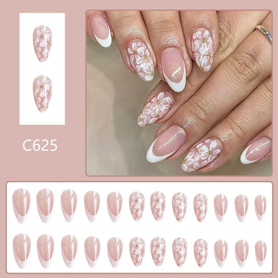 Removable short almond artificial nails with French style glitter flower design in colour C625
