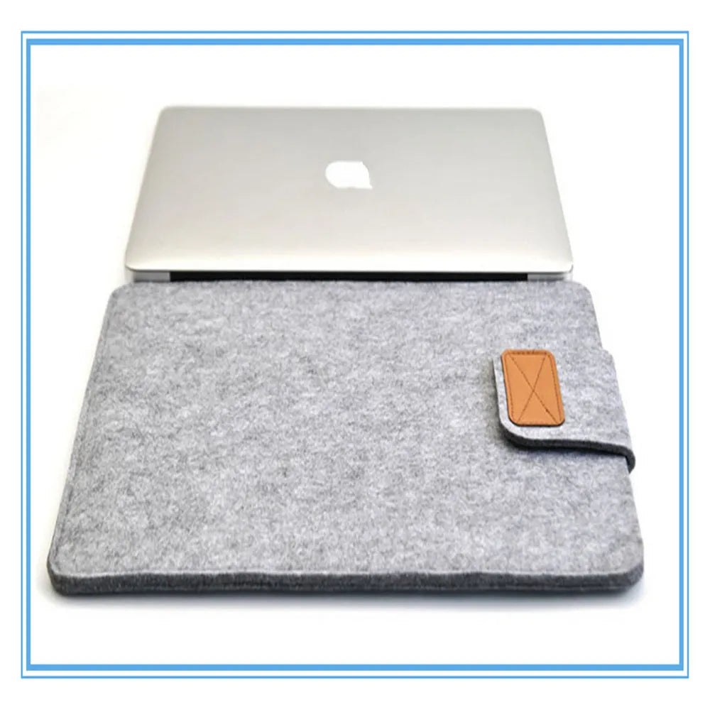 Dark grey felt plush clamshell laptop bag open to show interior with corner protectors
