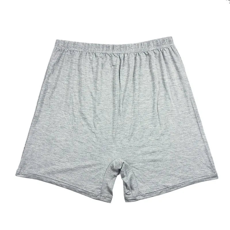 Men's solid colour high-waist boxers in modal fabric on size chart background