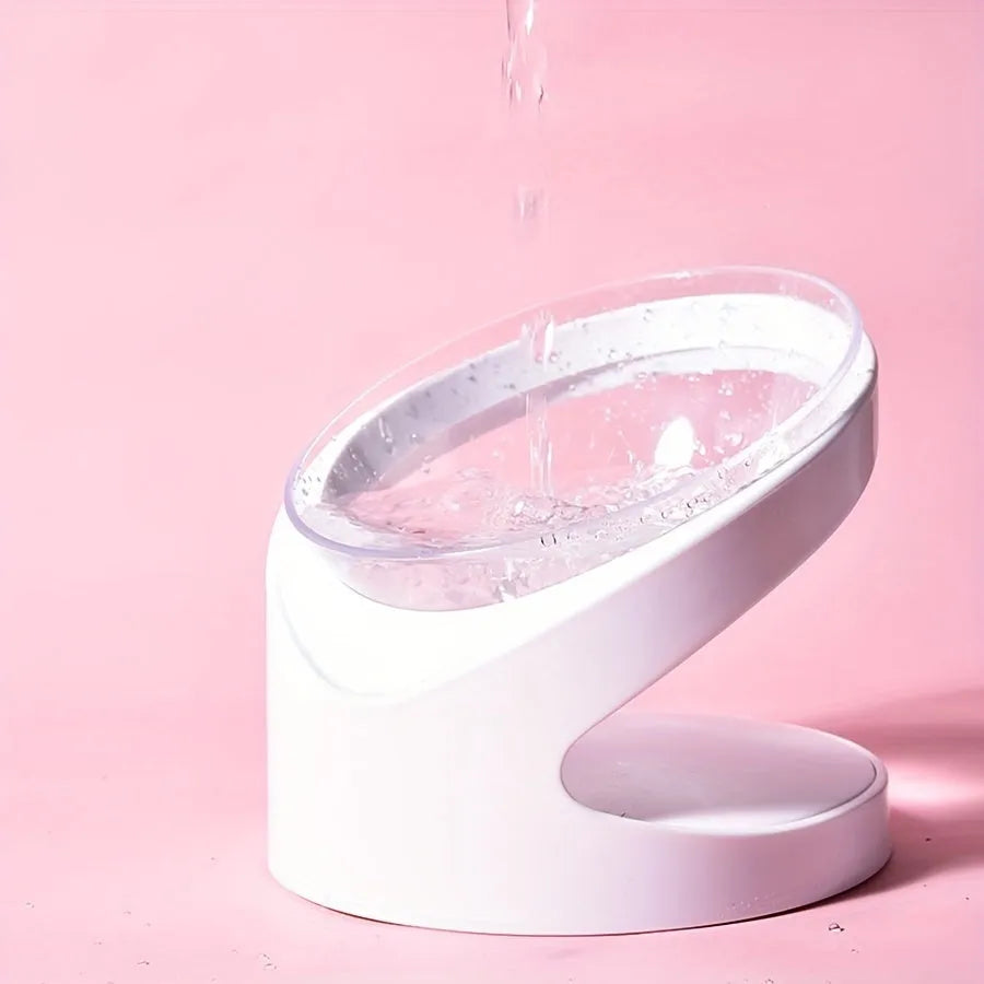 White clear elevated plastic cat food bowl with anti-vomit tilt design.