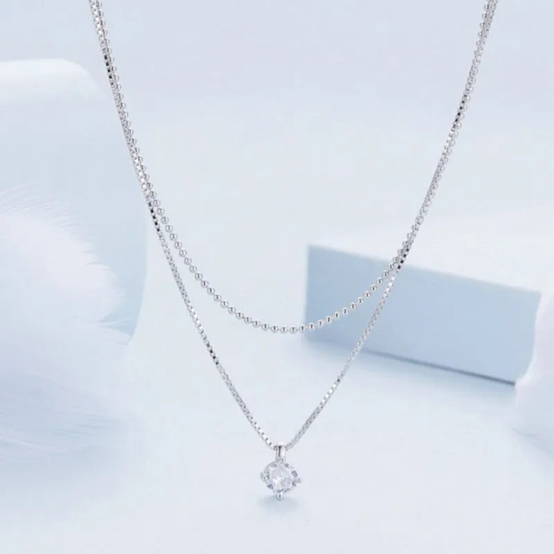 Women's double-layer sterling silver necklace with pearl chain design in silver colour