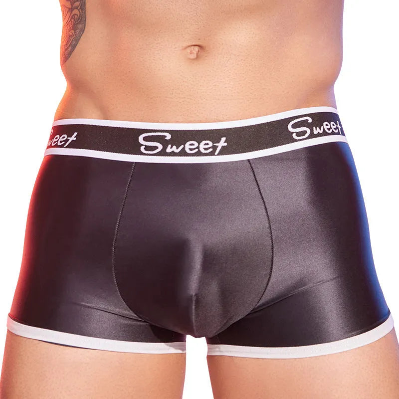 Men's silky nylon boxers in black, white, and sapphire blue colours on a white background.