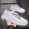 Men's white casual shoes with round toe and low heel on a flat breathable sole