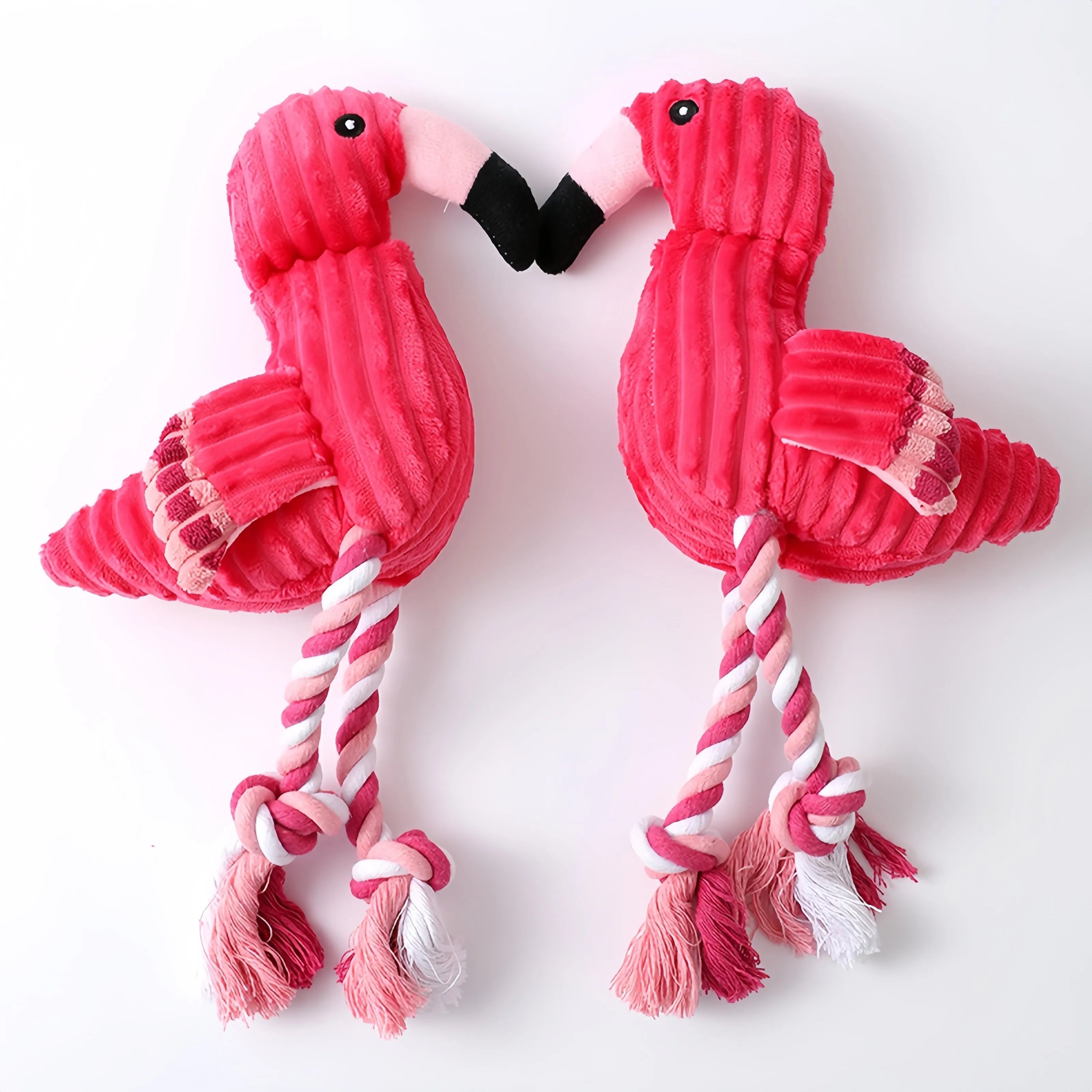 Pink animal-shaped plush dog toy with corduroy material and squeaker inside