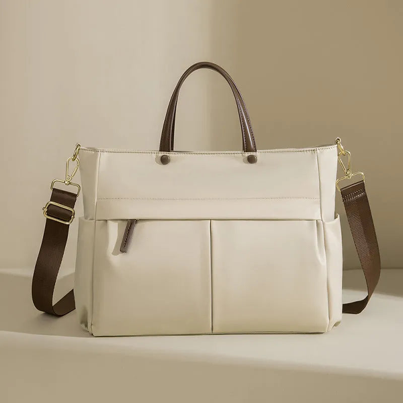 Women's oxford cloth laptop briefcase in elegant black showing open pocket and stitching detail