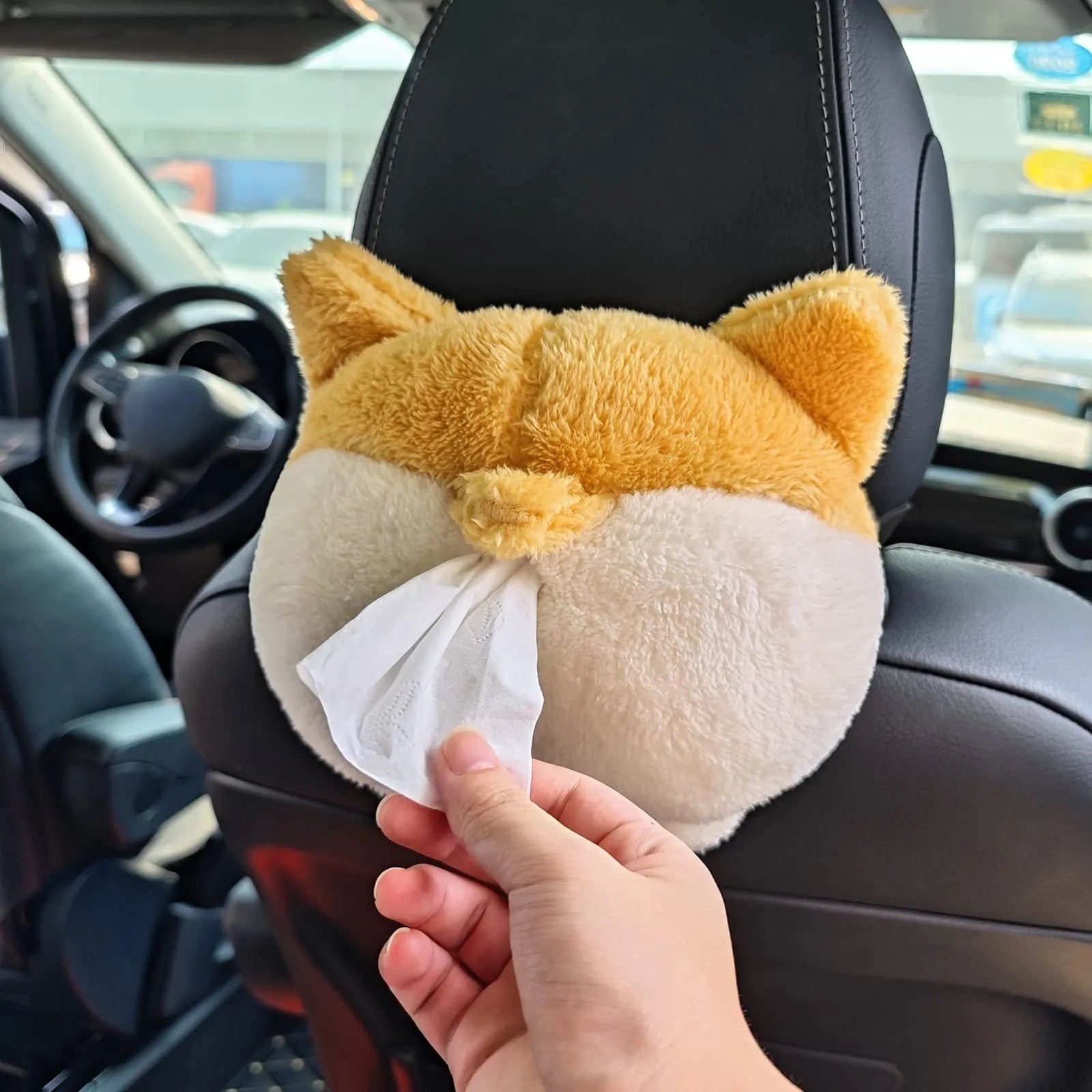 Yellow soft Corgi butt-shaped tissue box cover with elastic strap for car visor or home use.